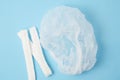 Medical disposable cap on blue background Royalty Free Stock Photo