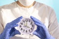 Medical woman doctor with an alarm clock in her hand . health care concept Royalty Free Stock Photo