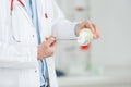 Medical doctor disinfecting pliers at hospital