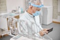 Medical doctor holding a tablet while working at clinic