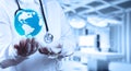 Medical Doctor holding a world globe in her hands Royalty Free Stock Photo