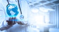 Medical Doctor holding a world globe in his hands Royalty Free Stock Photo