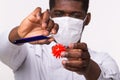 Medical doctor or laborant holding tube with Coronavirus vaccine for COVID-19. Coronavirus model in human hand. Vaccine