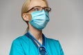 Medical doctor nurse woman with stethoscope wearing protective mask and rubber or latex gloves