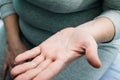 Medical doctor performs acupuncture on patients arm