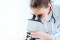 Medical doctor scientist looking at microscope in science laboratory research new Coronavirus from Wuhan concept Royalty Free Stock Photo