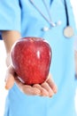 Medical doctor showing apple Royalty Free Stock Photo
