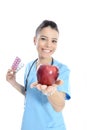 Medical doctor showing apple and pils Royalty Free Stock Photo