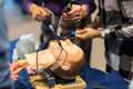 Medical doctor specialist expert displaying method of patient intubation technique on hands on medical education