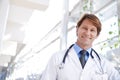 Healthcare. A medical doctor standing in a hospital corridor. Royalty Free Stock Photo