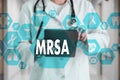 Medical Doctor with stethoscope and word MRSA ,Methicillin-Resistant Staphylococcus Aureus in Medical network connection on the v