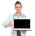 Medical doctor woman showing laptop and thumbs up Royalty Free Stock Photo