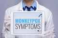 Medical doctor woman showing tablet PC with monkeypox symptoms Royalty Free Stock Photo