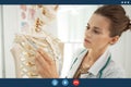 Medical doctor woman teaching anatomy using human skeleton model Royalty Free Stock Photo