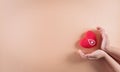 Medical and donor concepts. Child hand holding a handmade red heart, a sign or symbol of blood donation for world blood donor day Royalty Free Stock Photo