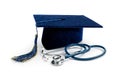 Medical education - college graduation cap and stethoscope on white background Royalty Free Stock Photo