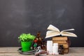 Medical education concept - books, pharmacy bottles, stethoscope in the auditorium with blackboard Royalty Free Stock Photo