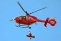 Medical emergency helicopter, Bucuresti, Romania - medic suspended on a rope with injured patient