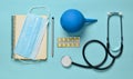 Medical equipment on a blue background. Enema, blisters pills, notepad, stethoscope, syringe, thermometer, manometer. Medical conc Royalty Free Stock Photo