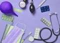 Medical equipment on a blue background. Enema, blisters pills, n Royalty Free Stock Photo