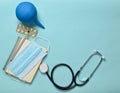 Medical equipment on a blue background. Enema, blisters pills, notepad, stethoscope, syringe, thermometer, manometer. Medical Royalty Free Stock Photo