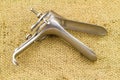 Medical equipment , Gynecologic Speculum on brown sack fabric Royalty Free Stock Photo