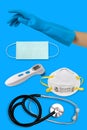 Medical equipment needed to prevent the spread of coronavirus. surgical mask, stethoscope, glove on blue background
