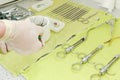 Medical equipment preparation for dental surgery probes files syringes on table