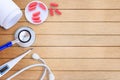 Medical equipment on wooden doctor desk background