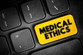 Medical Ethics - moral principles that govern the practice of medicine, text button on keyboard, concept background