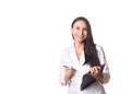 Medical exam, data collection. Doctor therapist with a pen and a clipboard. Friendly smiling adult woman in medical gown Royalty Free Stock Photo