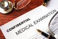 Medical examination form with title confidential. Royalty Free Stock Photo