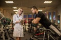 Medical examination. heart rate The doctor measures the pulse during a stress test. A female doctor measures a male Royalty Free Stock Photo