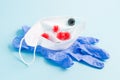 medical face mask, rubber disposable gloves on a blue background Royalty Free Stock Photo