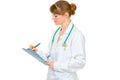 Medical female doctor writing in medical chart Royalty Free Stock Photo