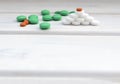 Medical flatlay with colourful pills and tablets . New year medical concept. Space for text