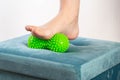 Medical foot massager. Removal of fatigue on the legs, relaxation. Home physiotherapy. Close-up Royalty Free Stock Photo