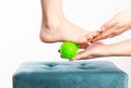 Medical foot massager. Removal of fatigue on the legs, relaxation. Home physiotherapy. Close-up Royalty Free Stock Photo