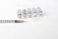 medical glass phials and syringe on white background. Syringe injection beauty concept Royalty Free Stock Photo