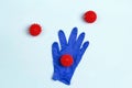 Medical gloves with abstract coronavirus molecule on blue background. Pandemic medical concept