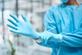 Medical gloves, medical gear and doctor hand in a wellness and health clinic ready for surgery. Safety, research and Royalty Free Stock Photo