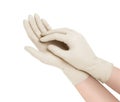 Medical gloves. Two white surgical gloves isolated on white background with hands. Rubber glove manufacturing, human