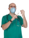 Medical green uniforms preparing a syringe Royalty Free Stock Photo