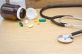 Medical headphones with medicine on the wooden background,Copy space