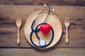 Medical Headphones Put On Wooden Plate - Healthy Eating Concept