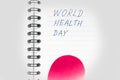 Medical health care concept, red heart, vignetting effect, words in Notepad world health day, top view