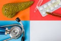 Medical or health care design concept photo-organ pancreas, diagnostic medical tool stethoscope and medications pills and via