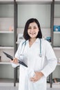 Medical Health Consulting Concept, Female Medicine Doctor Holding Tablet Standing in Clinic Healthcare. Physician Doctor Royalty Free Stock Photo