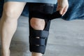 Medical and healthcare concept. Female leg in knee brace to help promote recovery of bones, muscles, ligaments Royalty Free Stock Photo