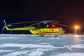 Medical helicopter on airport apron at night